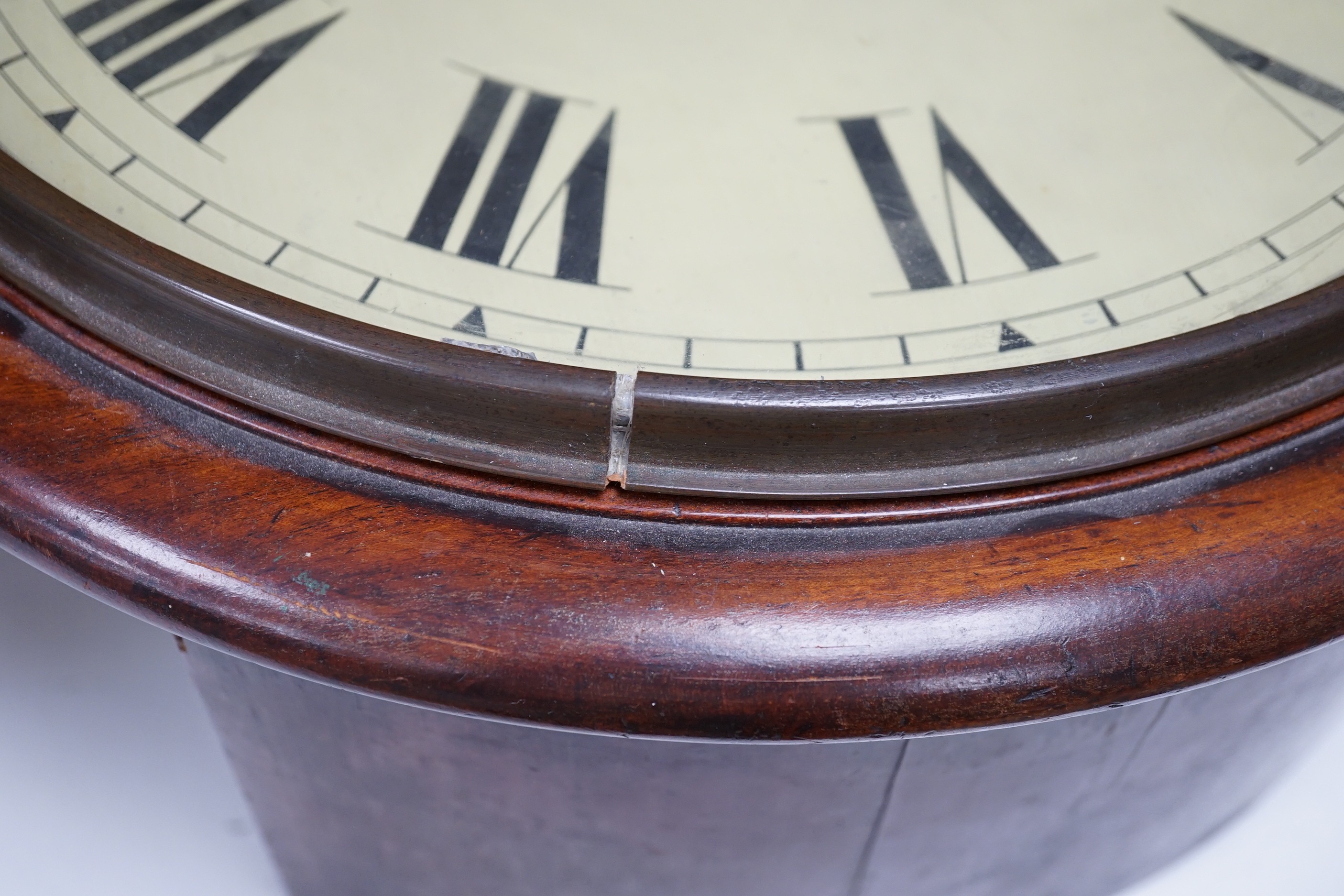 A Victorian mahogany dial timepiece, with pendulum. 36.5cm diameter